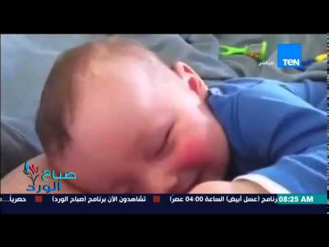 الفيديو طفل غارق فى نومه يضحك بطريقة هستيرية